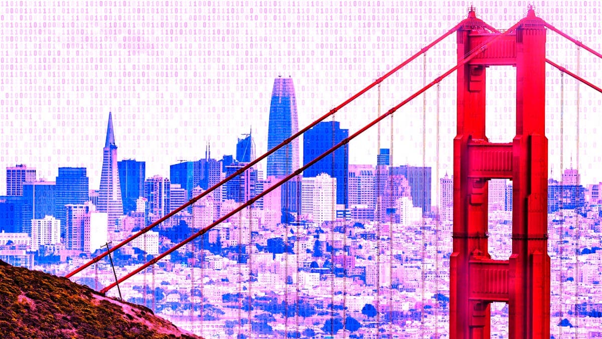 A digitally enhanced view of the Golden Gate Bridge in San Francisco, with vibrant red hues on the bridge and purple and blue tones in the cityscape background. Binary code overlays the sky. The city’s skyline is visible beneath the bridge cables